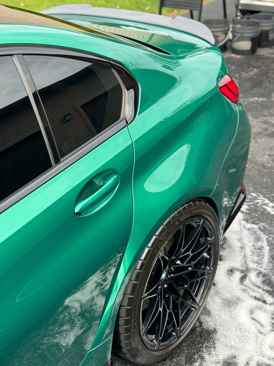 Glossy green car after wash