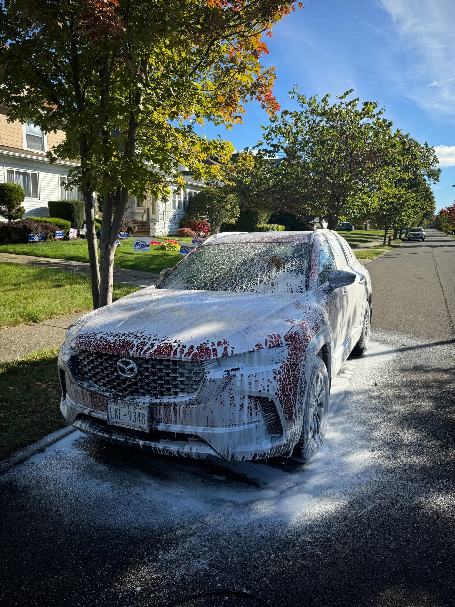Red Mazda getting detailed at home