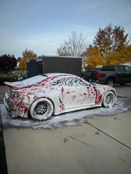 Toyota 86 being washed in driveway.